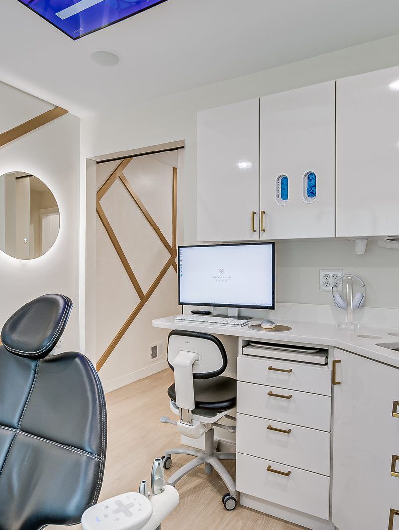 dental-operatory-gold-accent-wall-matawan-nj Modern dental operatory in Matawan with a gold geometric accent wall and new treatment chair